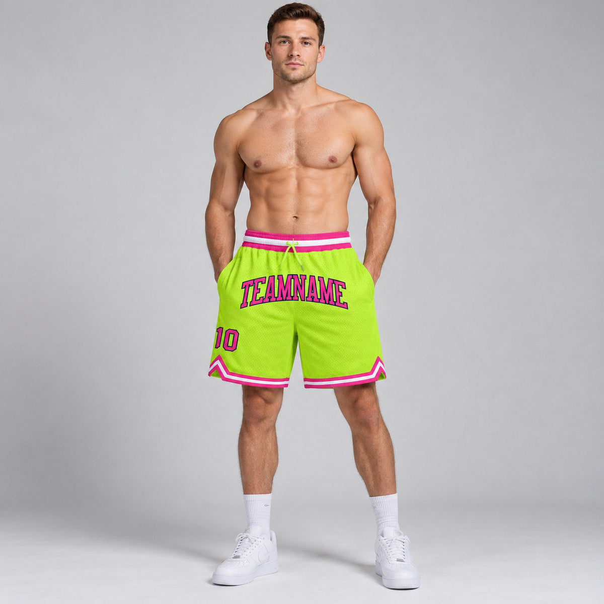 Custom Neon Green Authentic Throwback Basketball Shorts with Pink and Navy Lettering worn by male model