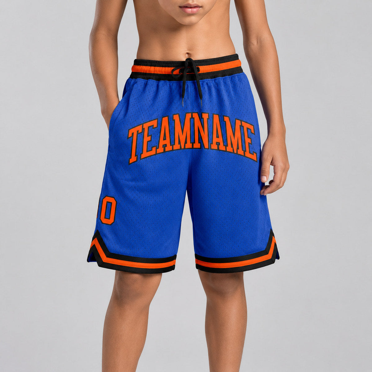 Custom Blue Authentic Throwback Basketball Shorts with Orange and Black Lettering youth size worn by child model