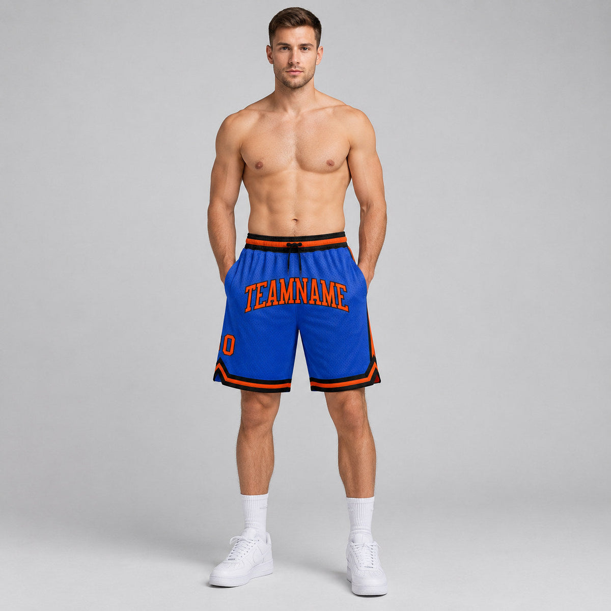Custom Blue Authentic Throwback Basketball Shorts with Orange and Black Lettering worn by male model