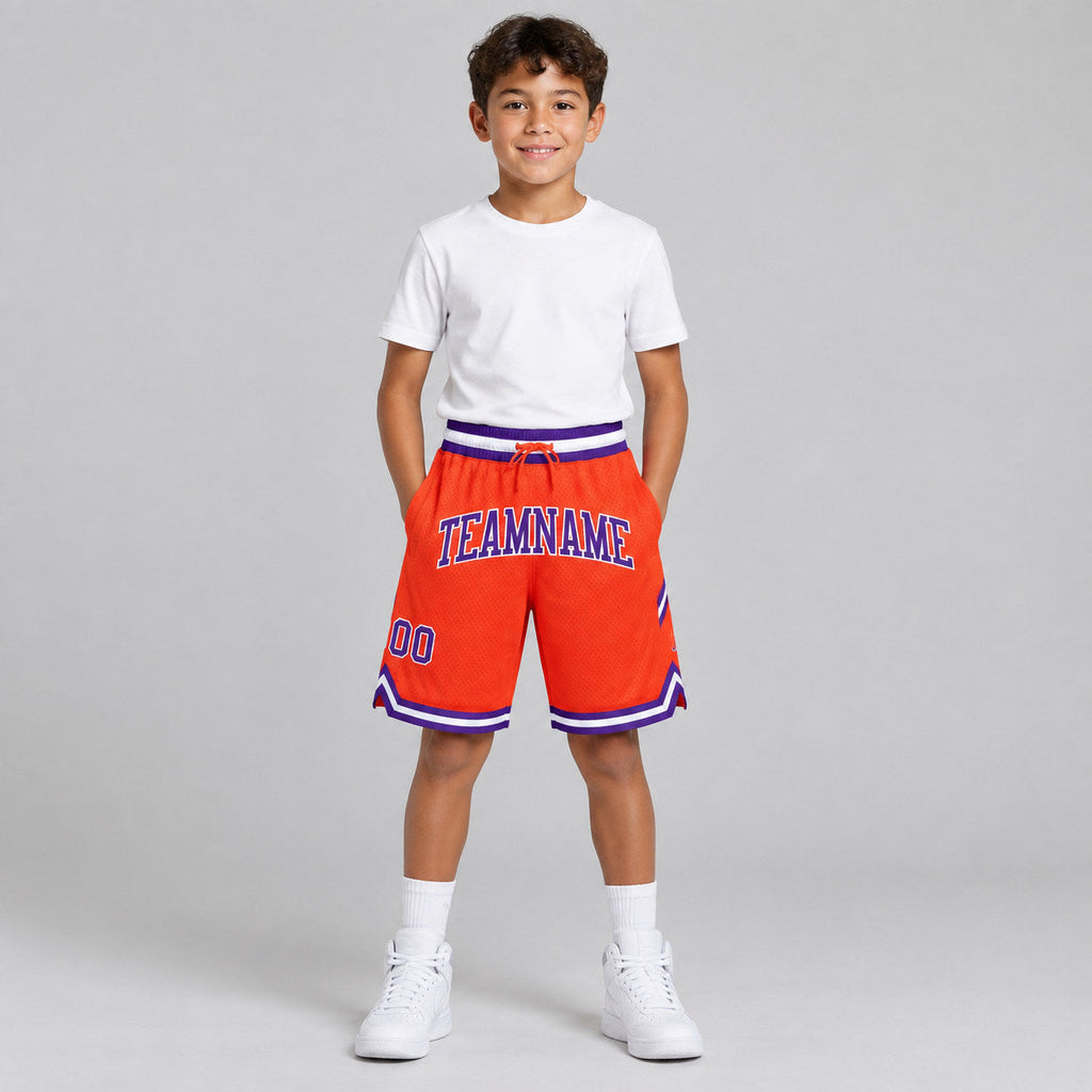Custom Orange Authentic Throwback Basketball Shorts with Purple and White Lettering youth size worn by child model