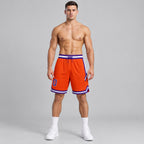 Custom Orange Authentic Throwback Basketball Shorts with Purple and White Lettering worn by male model