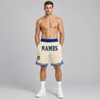Custom Cream Authentic Throwback Basketball Shorts with Royal and Gold Lettering worn by male model