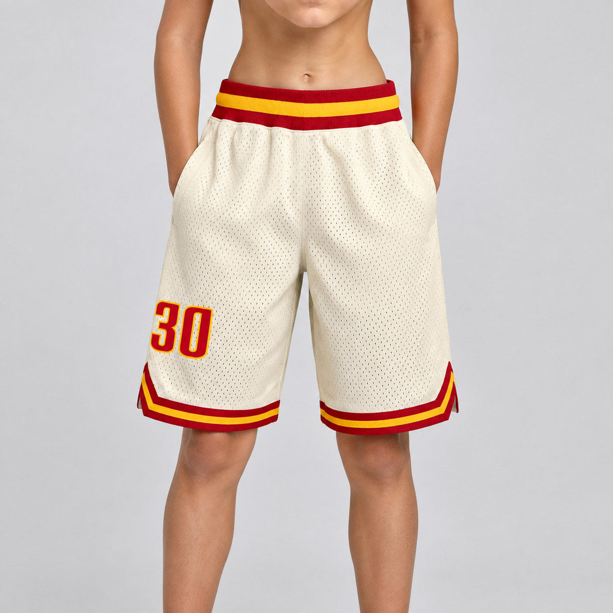 Custom Cream Authentic Throwback Basketball Shorts with Red and Gold Lettering Design 0083 youth size worn by child model