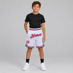 Custom White Authentic Throwback Basketball Shorts with Red and Navy Lettering youth size worn by child model