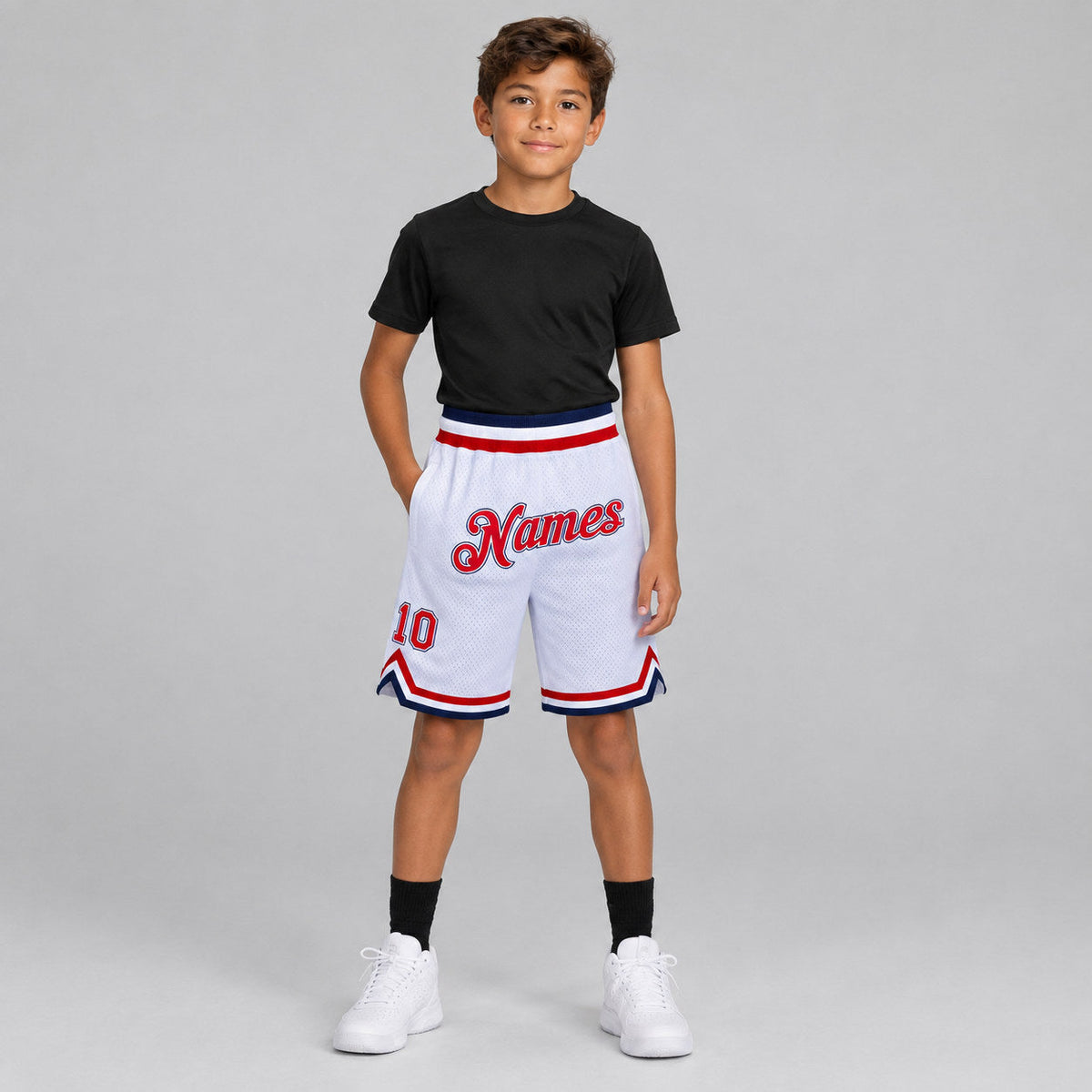 Custom White Authentic Throwback Basketball Shorts with Red and Navy Lettering youth size worn by child model
