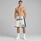 Custom Cream Authentic Basketball Shorts with Light Blue and Navy Lettering worn by male model