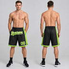 Custom Black Authentic Basketball Shorts with Neon Green and White Lettering worn by male model