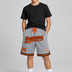 Custom Gray Authentic Throwback Basketball Shorts with Orange and Black Lettering youth size worn by child model