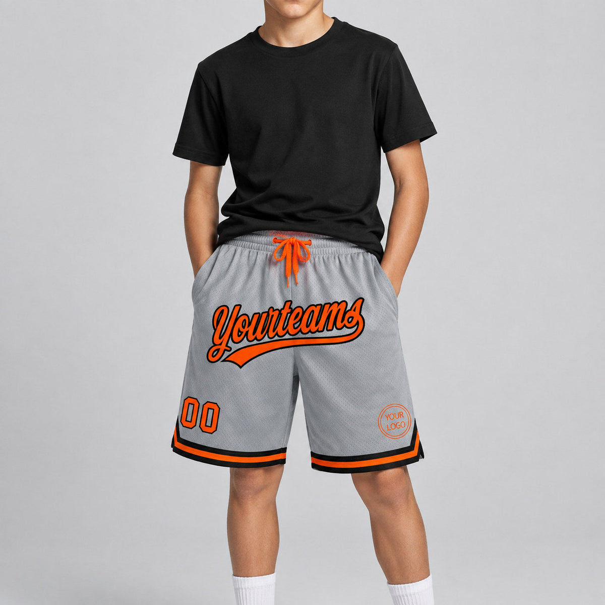 Custom Gray Authentic Throwback Basketball Shorts with Orange and Black Lettering youth size worn by child model