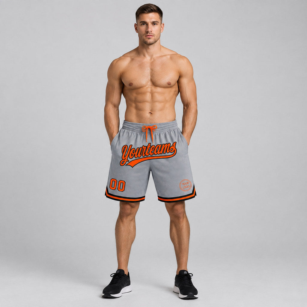 Custom Gray Authentic Throwback Basketball Shorts with Orange and Black Lettering worn by male model