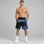 Custom Black Authentic Basketball Shorts with Royal and White Lettering worn by male model