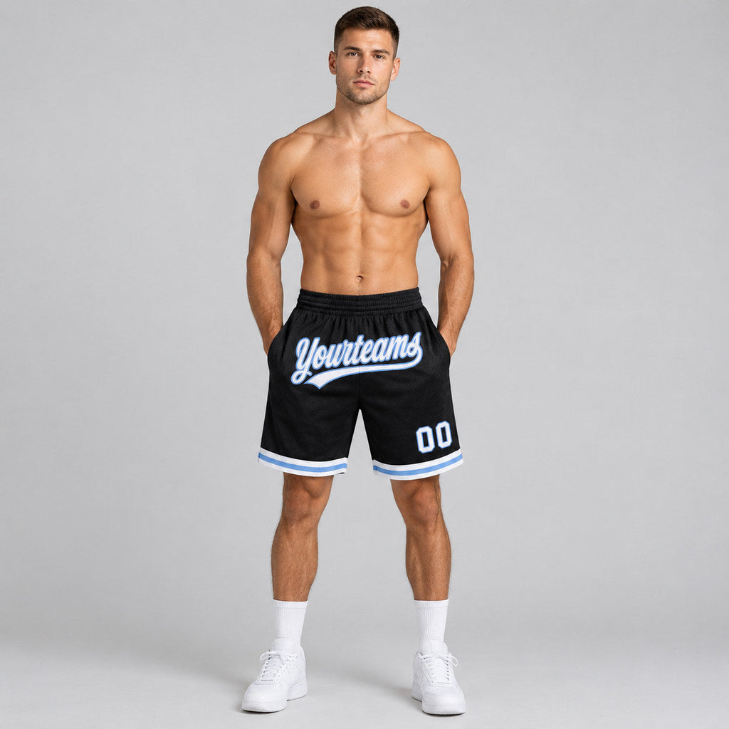 Custom Black Authentic Throwback Basketball Shorts with White and Light Blue Lettering worn by male model