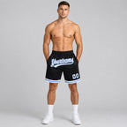 Custom Black Authentic Throwback Basketball Shorts with White and Light Blue Lettering worn by male model