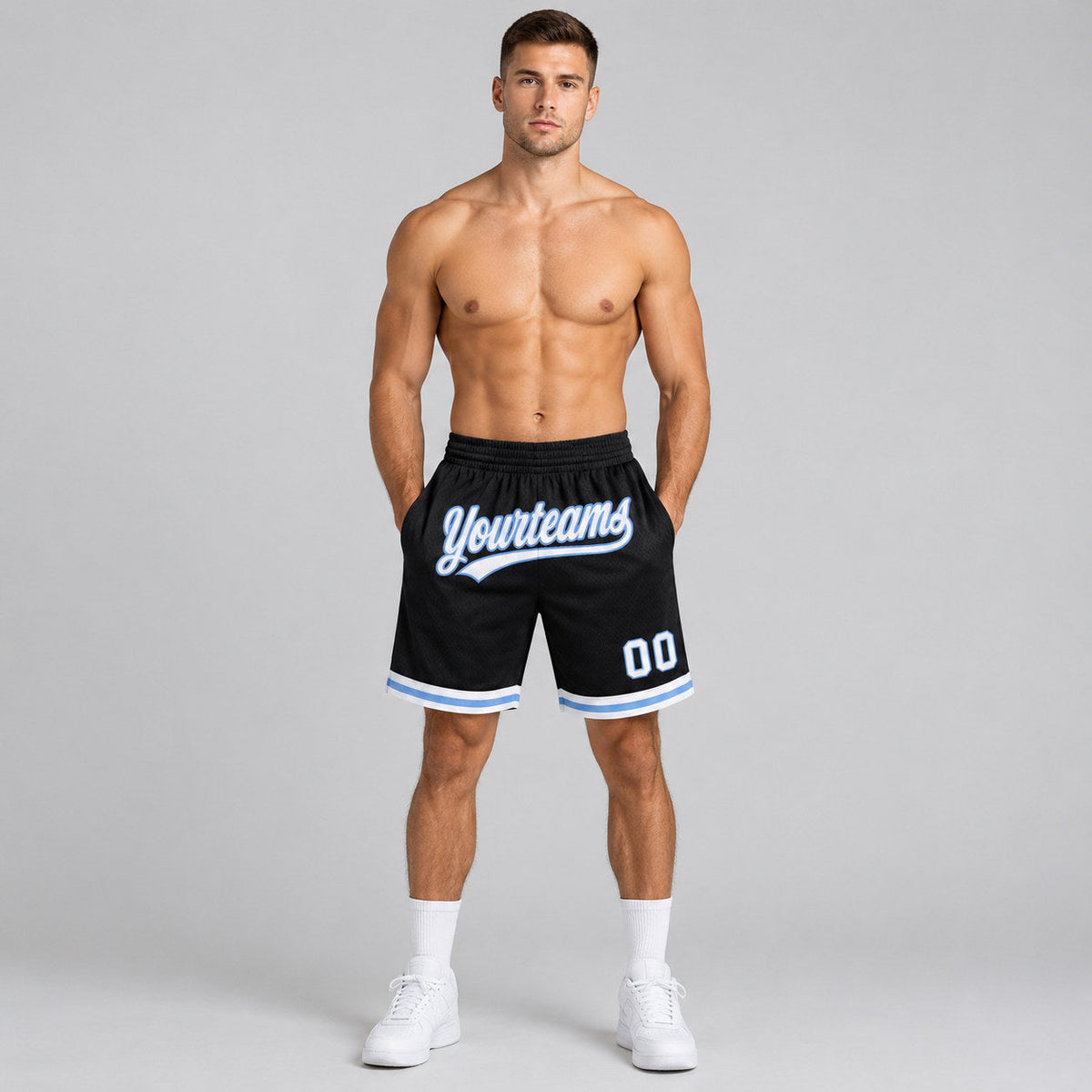 Custom Black Authentic Throwback Basketball Shorts with White and Light Blue Lettering worn by male model