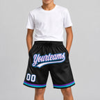 Custom Black and White Authentic Throwback Basketball Shorts with Purple and Teal Lettering youth size worn by child model