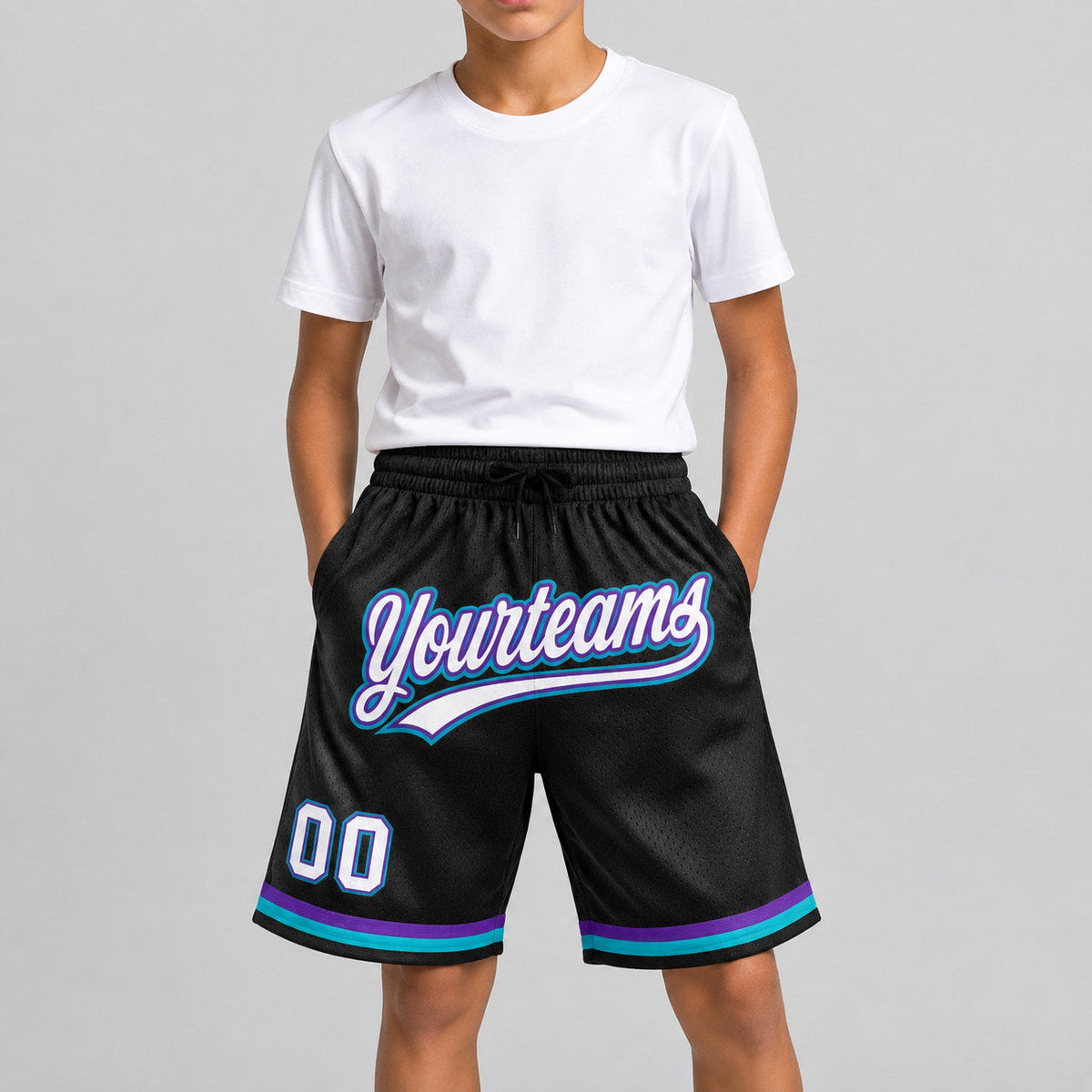 Custom Black and White Authentic Throwback Basketball Shorts with Purple and Teal Lettering youth size worn by child model