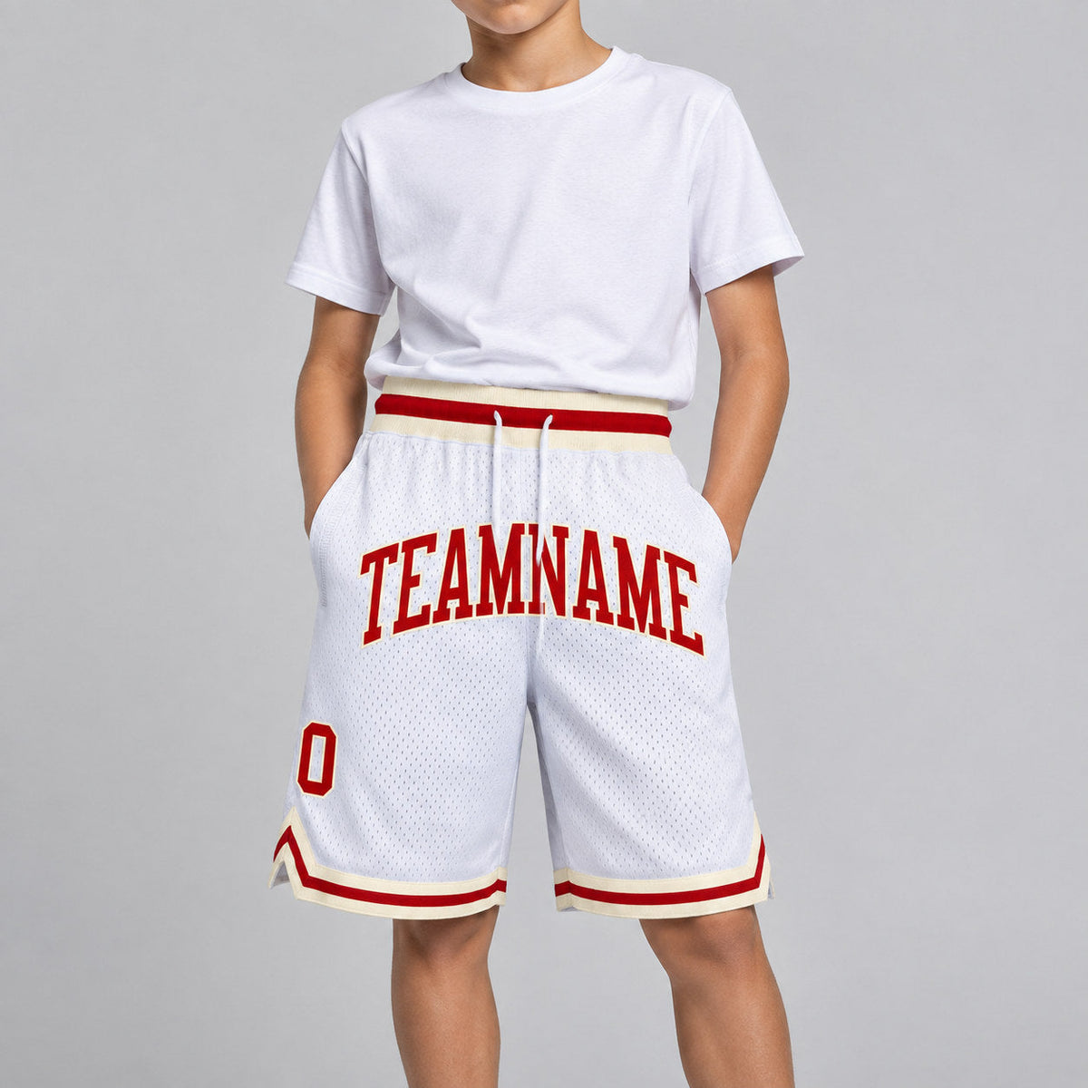 Custom White Authentic Throwback Basketball Shorts with Red and Cream Lettering youth size worn by child model