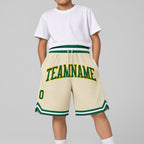 Custom Cream Authentic Throwback Basketball Shorts with Kelly Green and Gold Lettering youth size worn by child model