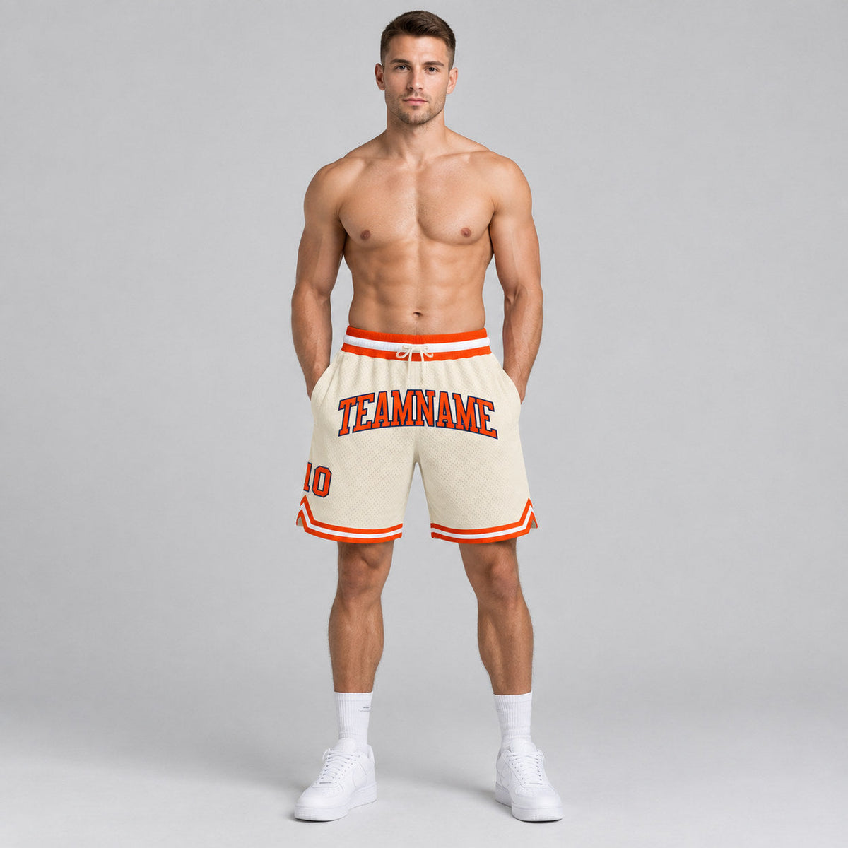 Custom Cream Authentic Throwback Basketball Shorts with Orange and Navy Lettering worn by male model