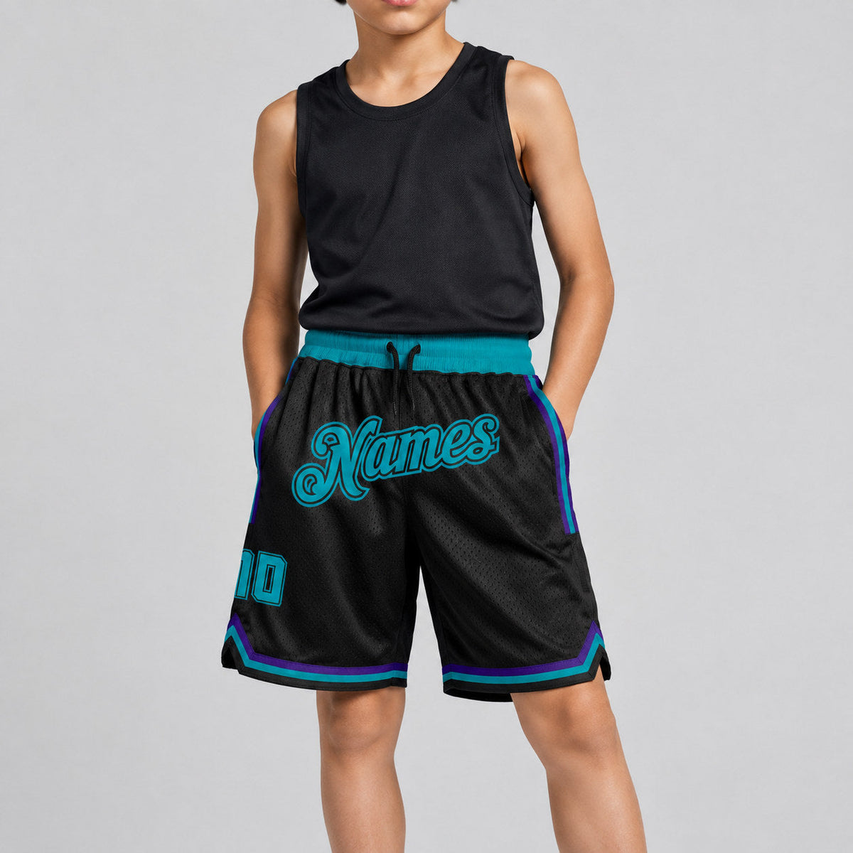 Custom Black Authentic Throwback Basketball Shorts with Teal and Black Lettering youth size worn by child model