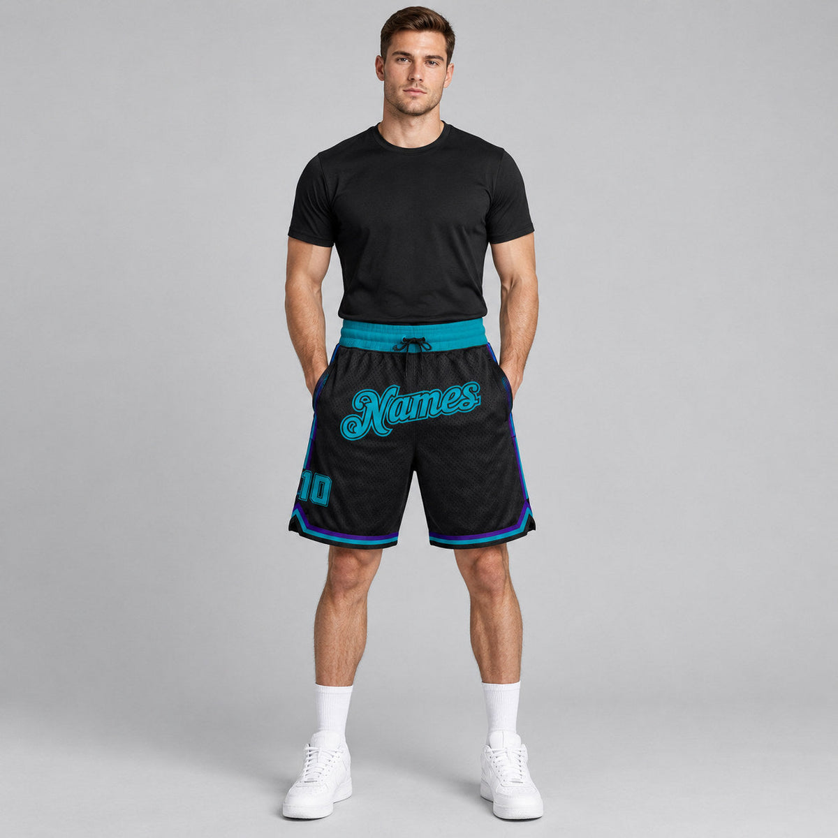 Custom Black Authentic Throwback Basketball Shorts with Teal and Black Lettering worn by male model