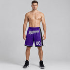 Custom Purple Authentic Basketball Shorts with White and Black Lettering worn by male model