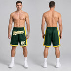 Custom Hunter Green Authentic Basketball Shorts with White and Yellow Lettering worn by male model
