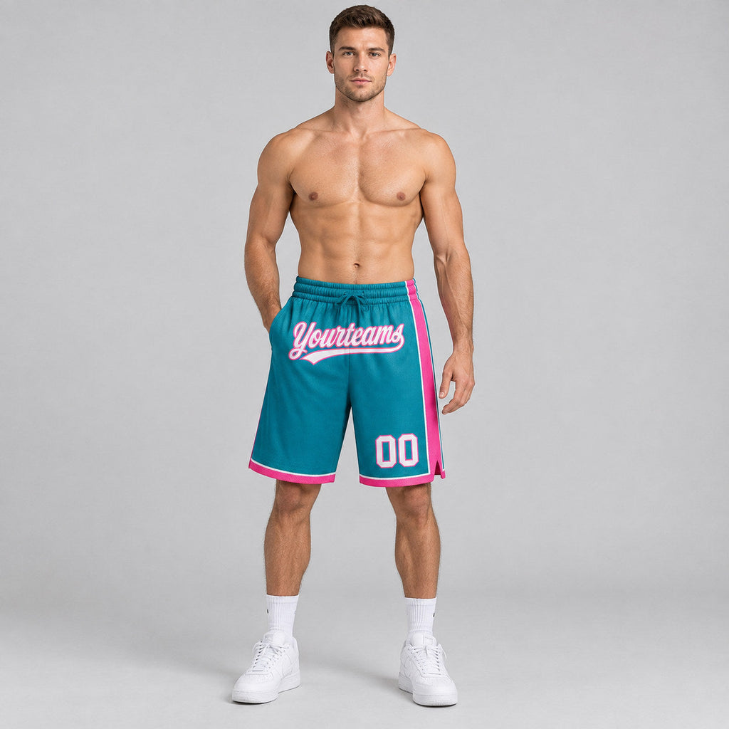 Custom Teal Authentic Basketball Shorts with White and Pink Lettering worn by male model