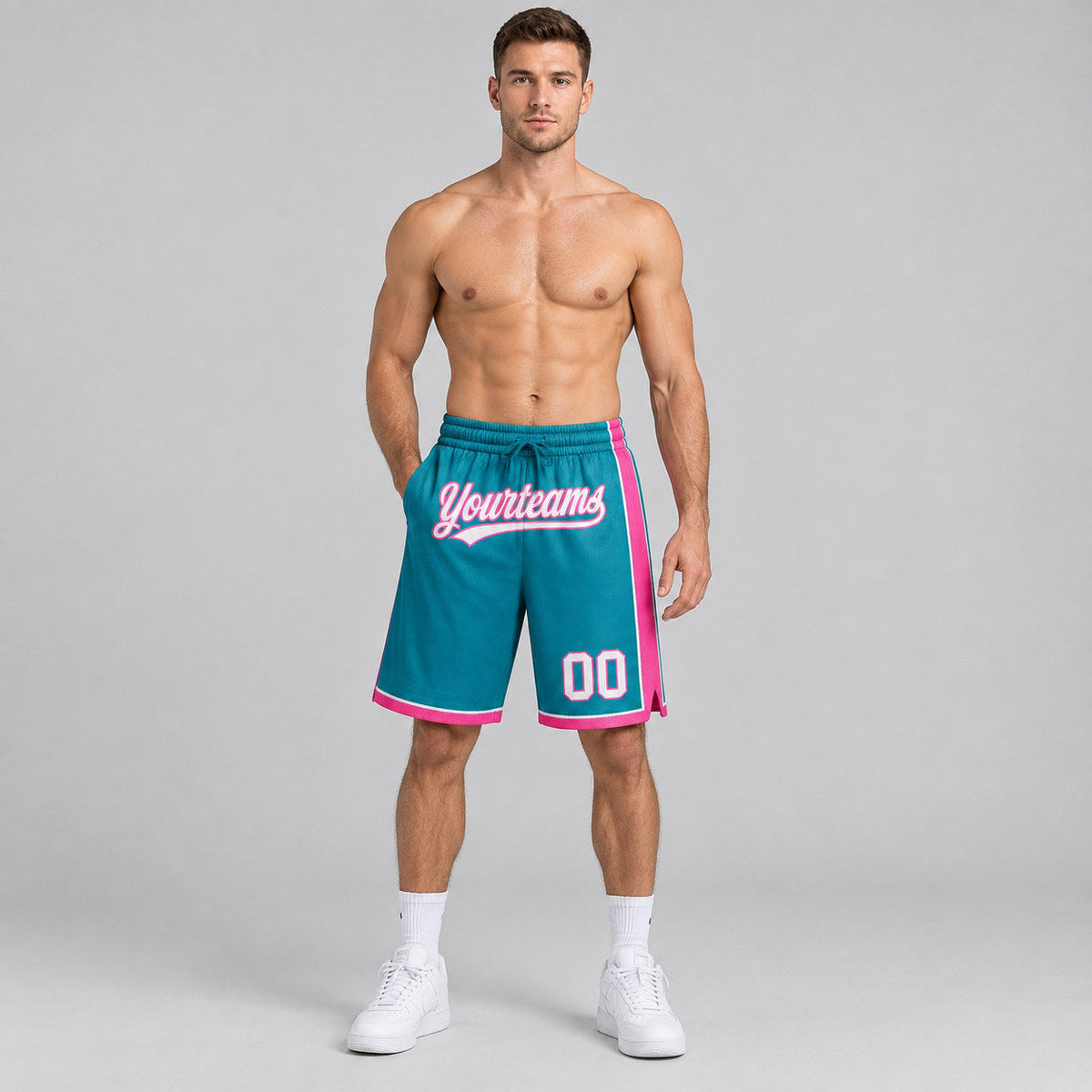 Custom Teal Authentic Basketball Shorts with White and Pink Lettering worn by male model