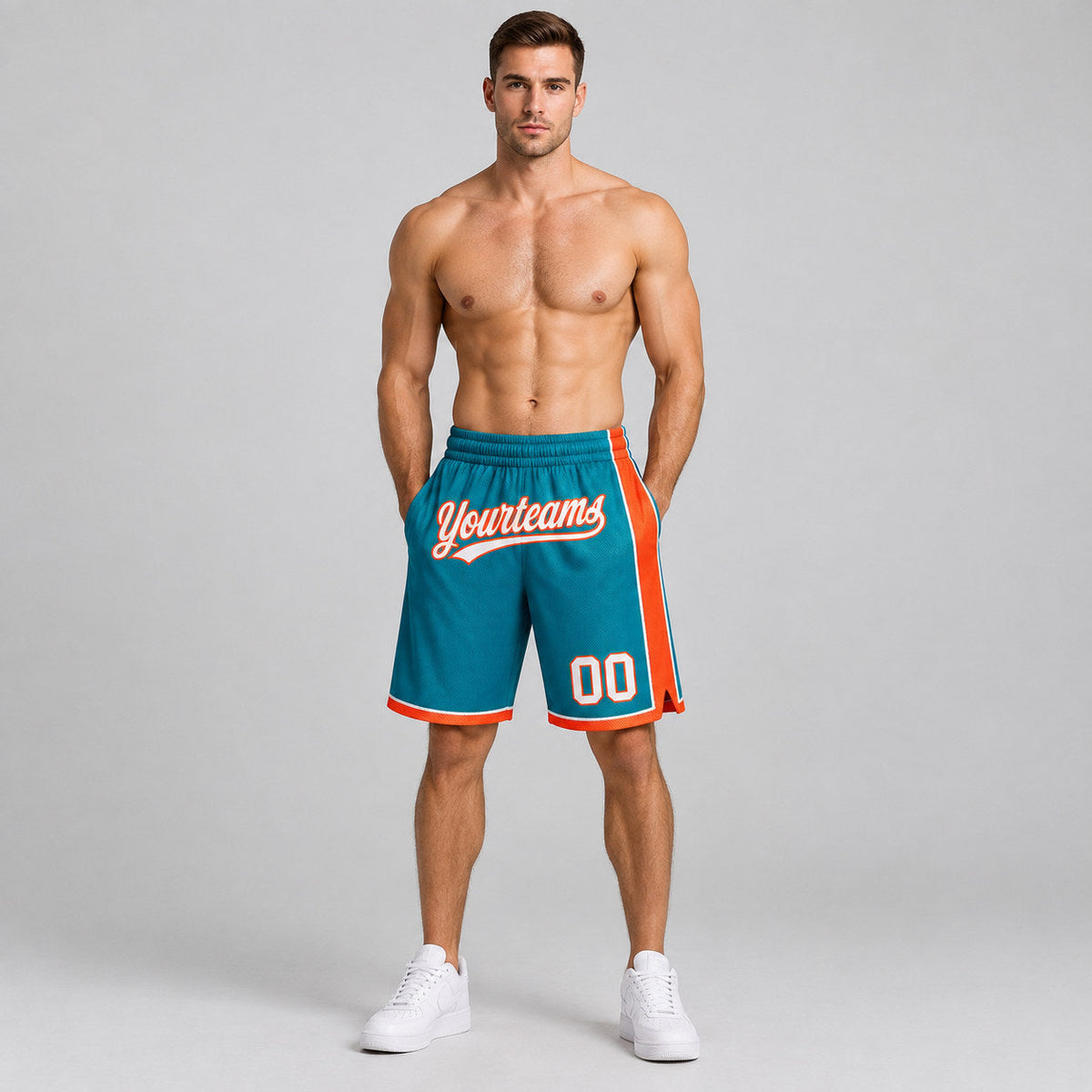 Custom Teal Authentic Basketball Shorts with White and Orange Lettering worn by male model