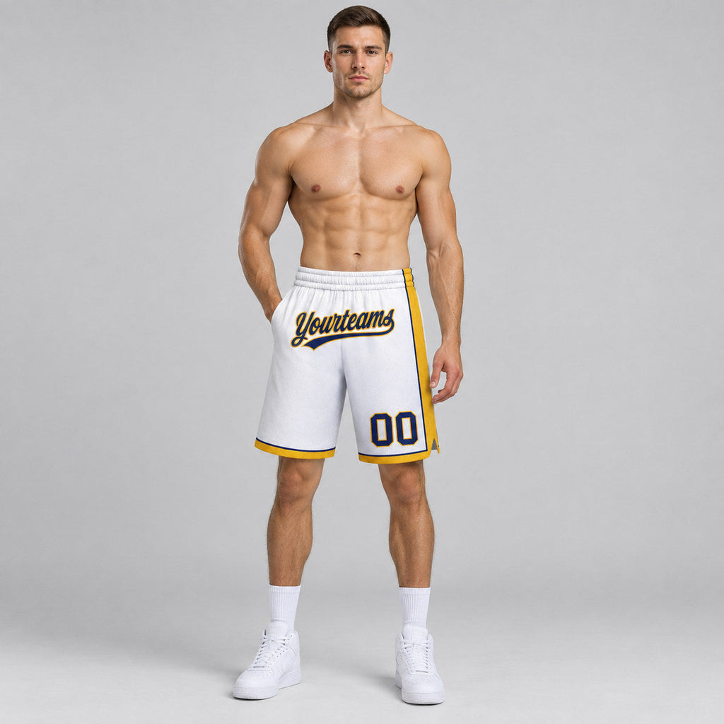 Custom White Authentic Basketball Shorts with Navy and Gold Lettering worn by male model