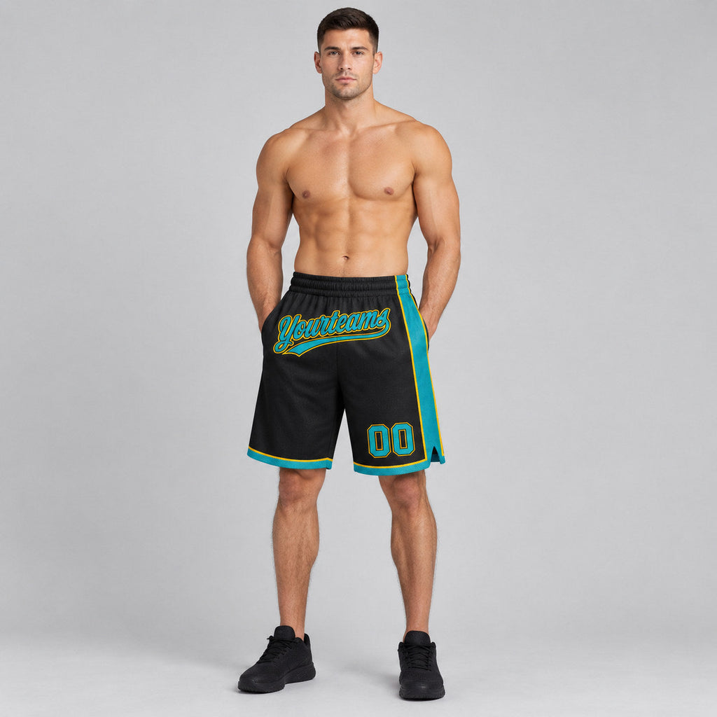 Custom Black Authentic Basketball Shorts with Teal and Yellow Lettering worn by male model