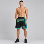 Custom Black Authentic Basketball Shorts with Teal and Yellow Lettering worn by male model