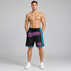 Custom Black Authentic Basketball Shorts with Pink and Teal Lettering worn by male model