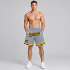 Custom Gray Authentic Throwback Basketball Shorts with Black and Gold Lettering worn by male model
