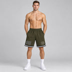 Custom Olive Salute To Service Authentic Throwback Basketball Shorts with Black and White Lettering worn by male model