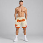 Custom Cream Authentic Throwback Basketball Shorts with Red and Gold Lettering Design 0448 worn by male model