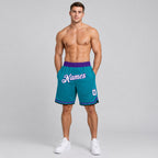 Custom Teal Authentic Throwback Basketball Shorts with White and Purple Lettering worn by male model