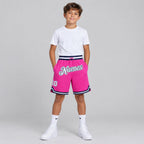 Custom Pink Authentic Throwback Basketball Shorts with White and Navy Lettering youth size worn by child model