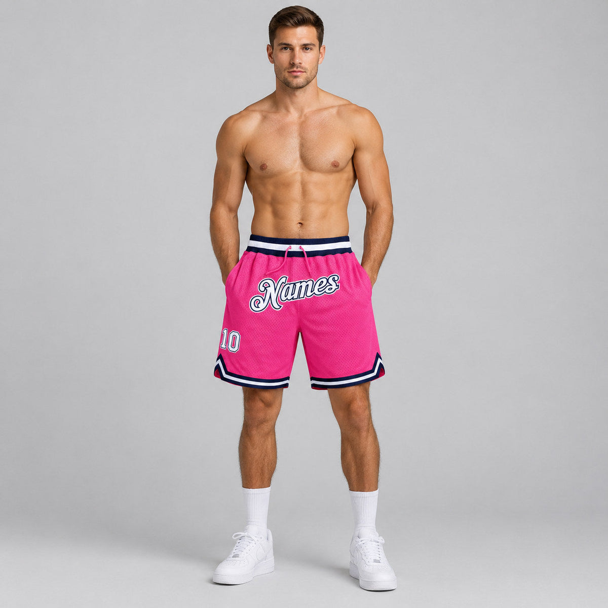 Custom Pink Authentic Throwback Basketball Shorts with White and Navy Lettering worn by male model