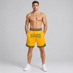 Custom Gold Authentic Throwback Basketball Shorts with Gold and Navy Lettering worn by male model