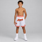 Custom White Authentic Throwback Basketball Shorts with Orange and Old Gold Lettering youth size worn by child model