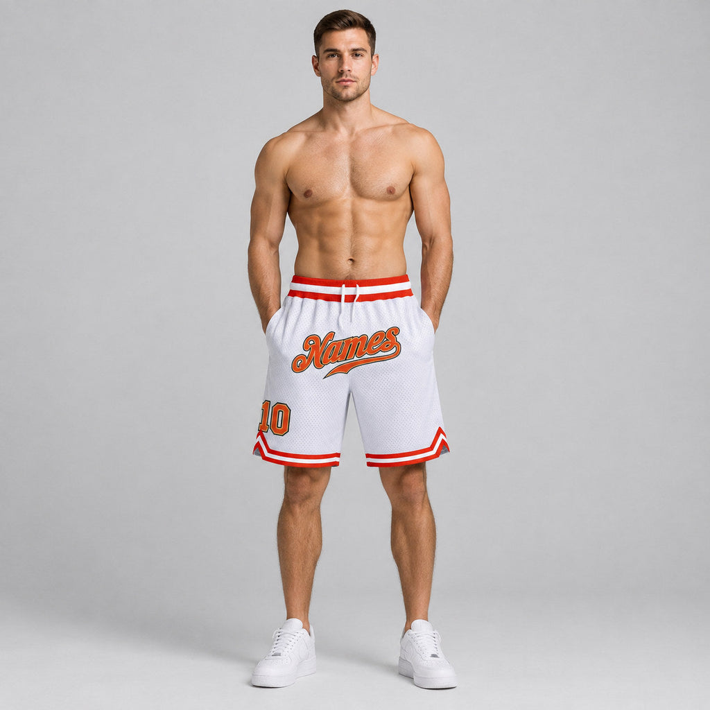 Custom White Authentic Throwback Basketball Shorts with Orange and Old Gold Lettering worn by male model
