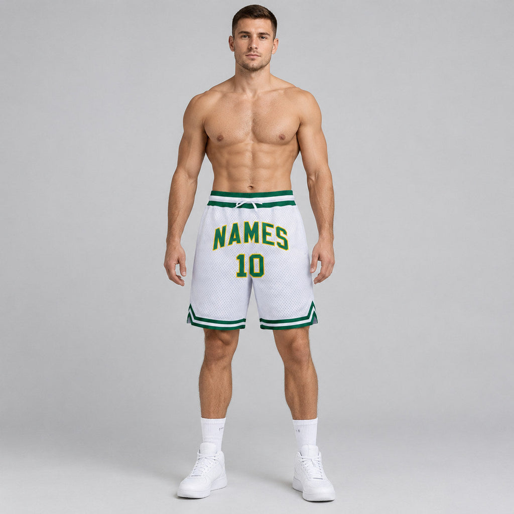 Custom White Authentic Throwback Basketball Shorts with Kelly Green and Gold Lettering worn by male model
