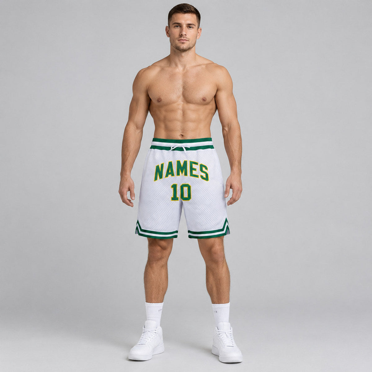 Custom White Authentic Throwback Basketball Shorts with Kelly Green and Gold Lettering worn by male model
