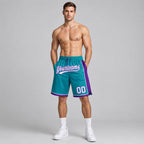 Custom Teal Authentic Basketball Shorts with White and Purple Lettering worn by male model
