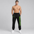 Custom Black Fleece Jogger Sweatpants with Neon Green Accents worn by male model