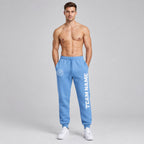 Custom Light Blue Fleece Jogger Sweatpants with White Accents worn by male model