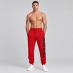 Custom Red Fleece Jogger Sweatpants with Black Accents worn by male model