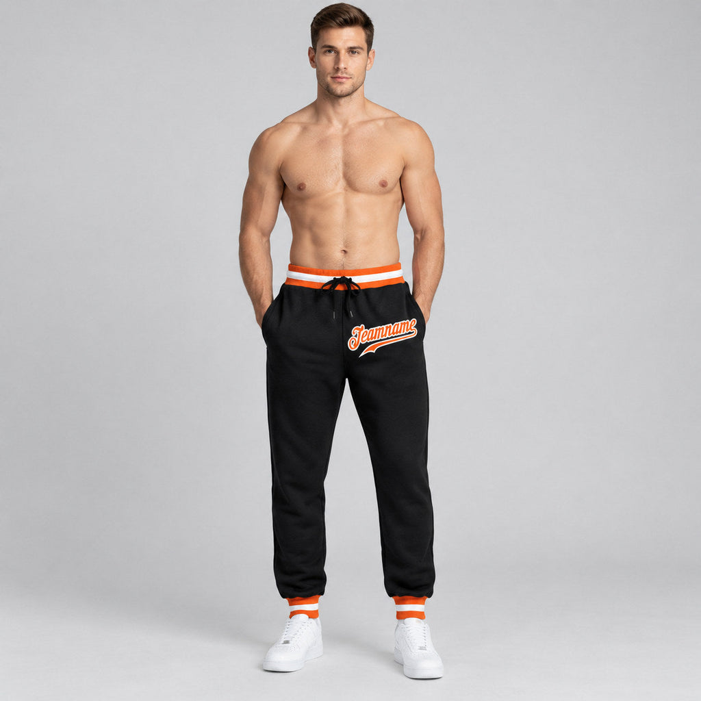 Custom Black Pants with Orange and White Accents worn by male model